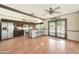 Open kitchen with stainless steel appliances, granite counters, bar seating and views of the backyard swimming pool at 730 W Curry St, Chandler, AZ 85225
