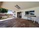 Covered back patio with a window and views to the backyard, offering an outdoor living space at 730 W Curry St, Chandler, AZ 85225