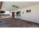 Covered back patio with stone flooring and windows, providing a private outdoor living space at 730 W Curry St, Chandler, AZ 85225