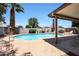 Inviting pool surrounded by lush landscaping and a covered patio, perfect for outdoor entertaining at 730 W Curry St, Chandler, AZ 85225