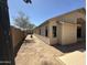 Side yard showing the exterior of the home with new landscaping potential at 7419 S 45Th Ave, Laveen, AZ 85339