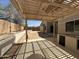 Backyard patio with built-in outdoor kitchen and pergola-covered dining area at 7419 S 45Th Ave, Laveen, AZ 85339