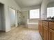 This bathroom features a glass-enclosed shower and a separate soaking tub beneath a privacy window at 7419 S 45Th Ave, Laveen, AZ 85339