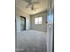 Carpeted bedroom features neutral paint, ceiling fan, and closet at 7419 S 45Th Ave, Laveen, AZ 85339