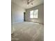 Bedroom with neutral carpet, fan, and a sun-drenched window create a cozy and inviting space at 7419 S 45Th Ave, Laveen, AZ 85339