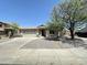 Charming single story home featuring a two-car garage, desert landscaping, and mature trees at 7419 S 45Th Ave, Laveen, AZ 85339