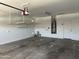 Clean garage with ample storage racks and water heater at 7419 S 45Th Ave, Laveen, AZ 85339