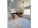 Bright kitchen features tile floors, kitchen island, and granite countertops at 7419 S 45Th Ave, Laveen, AZ 85339