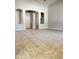 Inviting living room with arched features, tile flooring, and neutral color scheme at 7419 S 45Th Ave, Laveen, AZ 85339