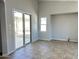 Bright living room with a sliding glass door leading to the backyard and lots of natural light at 7419 S 45Th Ave, Laveen, AZ 85339