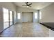 Open floor plan with tiled floors, slider to the patio, and vaulted ceiling at 7419 S 45Th Ave, Laveen, AZ 85339