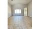 Open and airy living space features high ceilings, natural light, and neutral finishes at 7419 S 45Th Ave, Laveen, AZ 85339