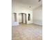 Spacious living area with vaulted ceilings, archways, and neutral tile floors at 7419 S 45Th Ave, Laveen, AZ 85339