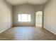 Bright living room with a large window for natural light and tile flooring throughout at 7419 S 45Th Ave, Laveen, AZ 85339