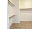 Bright walk-in closet featuring built-in shelving and a rod for maximum storage at 7419 S 45Th Ave, Laveen, AZ 85339