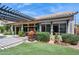 Backyard featuring a covered patio, outdoor seating, and lush green lawn at 758 S Lagoon Dr, Gilbert, AZ 85233