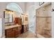 Elegant bathroom featuring double vanities with granite countertops and a tiled walk-in shower at 758 S Lagoon Dr, Gilbert, AZ 85233