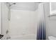 Clean and bright bathroom featuring a shower with a white shower curtain at 758 S Lagoon Dr, Gilbert, AZ 85233