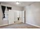 Well-lit bedroom with a carpet floor, a ceiling fan, and an ensuite bathroom at 758 S Lagoon Dr, Gilbert, AZ 85233