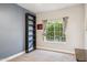 Bedroom with natural light from a window and a built-in bookshelf at 758 S Lagoon Dr, Gilbert, AZ 85233