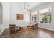Bright and airy living room with hardwood floors, ceiling fan, and large windows at 758 S Lagoon Dr, Gilbert, AZ 85233
