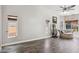 Bright living room featuring wood floors, large windows, and a comfortable chaise lounge at 758 S Lagoon Dr, Gilbert, AZ 85233