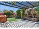 Outdoor living space featuring a fireplace, seating, and manicured lawn at 758 S Lagoon Dr, Gilbert, AZ 85233