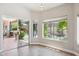Bright dining area featuring a large patio door with view of landscaped backyard and covered patio at 758 S Lagoon Dr, Gilbert, AZ 85233