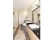 Spacious bathroom boasts a luxurious tub, double vanity, and a large mirror reflecting the room's elegance at 7601 E Indian Bend Rd # 1040, Scottsdale, AZ 85250