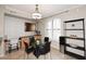 Cozy dining area with modern light fixture and a nearby workspace at 7601 E Indian Bend Rd # 1040, Scottsdale, AZ 85250