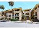 Stunning multi-story building featuring a neutral color palette, private balconies and manicured landscaping at 7601 E Indian Bend Rd # 1040, Scottsdale, AZ 85250