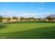 Expansive golf course view features manicured greens under a bright sky, perfect for a serene getaway at 7601 E Indian Bend Rd # 1040, Scottsdale, AZ 85250
