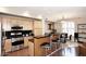 Gourmet kitchen with light wood cabinets, granite countertops, stainless steel appliances, and hardwood floors at 7601 E Indian Bend Rd # 1040, Scottsdale, AZ 85250