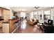 Inviting living room with hardwood floors and an open floorplan flowing to the kitchen and lots of natural light at 7601 E Indian Bend Rd # 1040, Scottsdale, AZ 85250