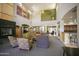 Expansive living room with fireplace, high ceilings, and stylish furnishings for comfortable living at 7601 E Indian Bend Rd # 1040, Scottsdale, AZ 85250