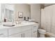 Bright bathroom with a white vanity, marble countertop, and a combination tub and shower at 8396 E Granite Pass Rd, Scottsdale, AZ 85266