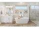 Bathroom with a glass shower, a soaking tub and a bright window at 8396 E Granite Pass Rd, Scottsdale, AZ 85266