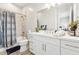 Well-lit bathroom showcasing a modern vanity, combination tub and shower, and neutral finishes at 8396 E Granite Pass Rd, Scottsdale, AZ 85266