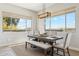Dining area with modern light fixture and views of the desert landscape at 8396 E Granite Pass Rd, Scottsdale, AZ 85266