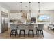 Modern kitchen featuring a large island, stainless steel appliances, and stylish pendant lighting at 8396 E Granite Pass Rd, Scottsdale, AZ 85266