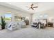 Spacious main bedroom with large windows and sitting area with comfortable chairs at 8396 E Granite Pass Rd, Scottsdale, AZ 85266