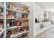 Walk-in pantry with abundant shelving in a well-organized kitchen at 8396 E Granite Pass Rd, Scottsdale, AZ 85266