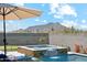 Stunning pool and spa combo with integrated waterfall feature and mountain views, perfect for relaxation and enjoyment at 8396 E Granite Pass Rd, Scottsdale, AZ 85266