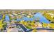 A beautiful aerial view of the Desert Harbor waterfront community and meticulously landscaped yards at 9109 W Watson Ln, Peoria, AZ 85381