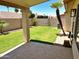 Lush backyard with a grassy lawn and desert landscaping at 9109 W Watson Ln, Peoria, AZ 85381