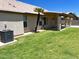 Expansive backyard features a well-maintained lawn, palm trees, and desert landscaping at 9109 W Watson Ln, Peoria, AZ 85381