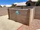 The unique backyard block fencing offers privacy, decoration, and complements this pool's desert aesthetic at 9109 W Watson Ln, Peoria, AZ 85381