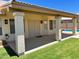 Inviting backyard patio with sturdy columns, offering shade and access to a pool, ideal for entertaining at 9109 W Watson Ln, Peoria, AZ 85381