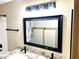 Modern mirror and vanity with granite countertop at 9109 W Watson Ln, Peoria, AZ 85381