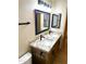 Double sink bathroom with granite countertop, black fixtures, and tile flooring at 9109 W Watson Ln, Peoria, AZ 85381